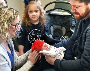 Babies receive hats with heart through Little Hats, Big Hearts Program